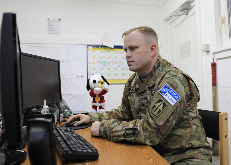 While deployed to Camp Bondsteel, Kosovo, in support of Operation Joint Guardian, Sgt. Allen Clark, Task Force Nighthawk, 76 Infantry Brigade Combat Team, Indiana Army National Guard, initiates software updates to enhance computer security features on December 21, 2022.