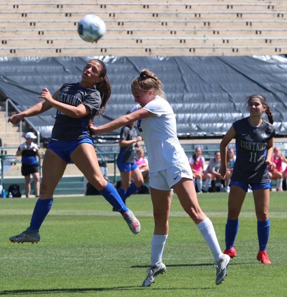 Bartram Trail's Grace Ivey, right, heads a shot during the 2021 Class 7A state final against Cypress Bay.