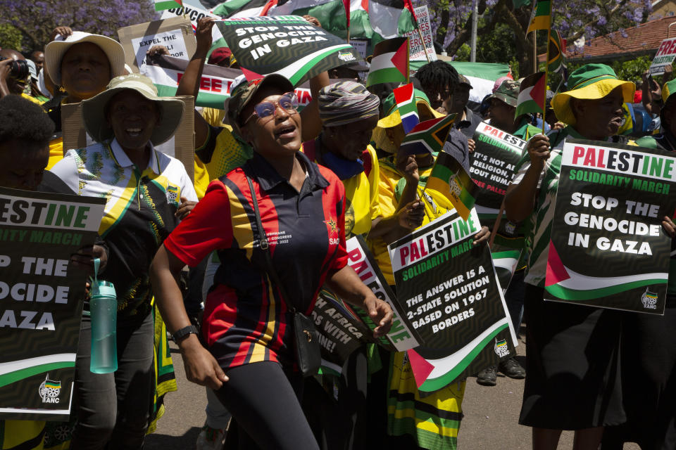 FILE - Pro-Palestinian supporters demonstrate at the entrance to the Israeli embassy in Pretoria, South Africa, Friday, Oct. 20, 2023. South Africa's long-held support for the Palestinian people can be traced back to the time of the late Nelson Mandela and Palestinian leader Yasser Arafat, with the two leaders believing that the struggle for freedom by Blacks in apartheid South Africa and Palestinians in Gaza and the West Bank were the same. (AP Photo/Denis Farrell, File)