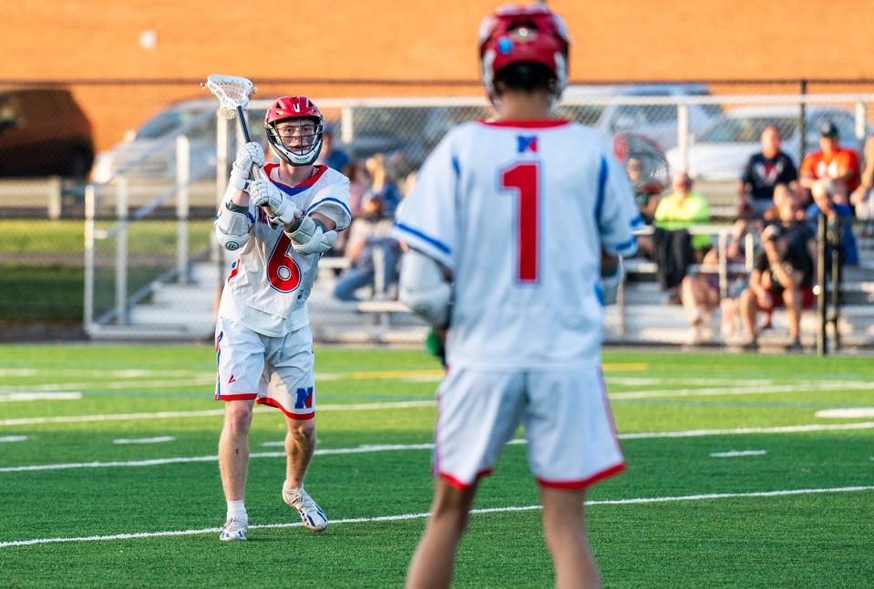 Neshaminy's Jack Sexton (6) passes the ball to Colin Demi (1) against Central Bucks South during their boys' lacrosse game in Langhorne on Thursday, May 2, 2024.
