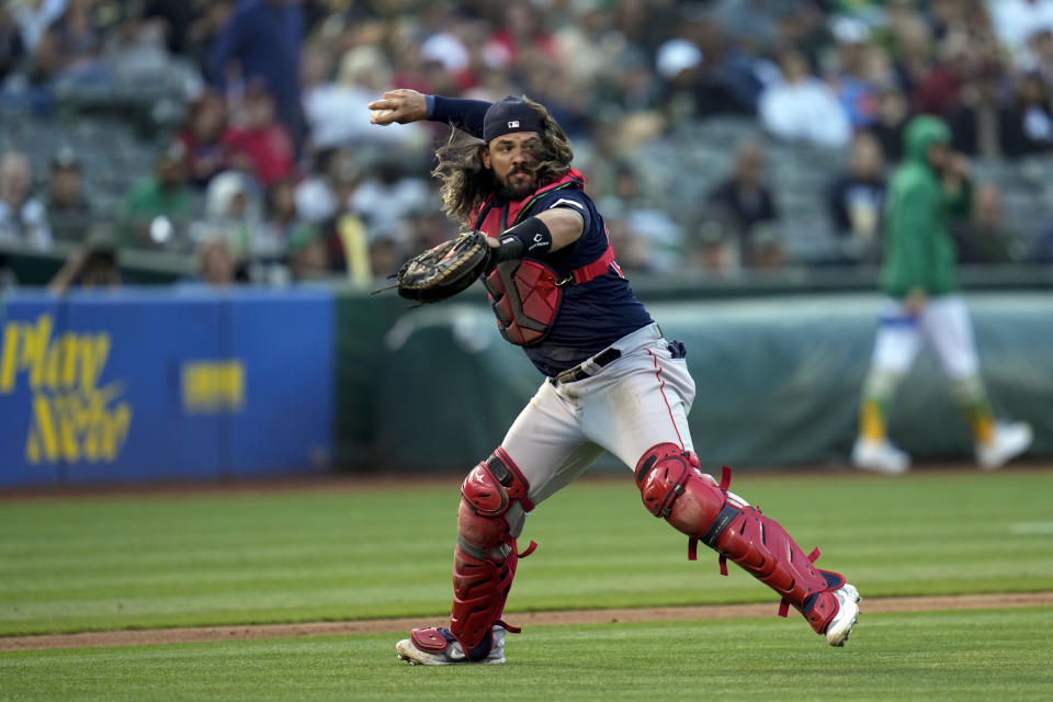 Boston Red Sox catcher Jorge Alfaro throws to first for an out on Oakland Athletics' Nick Allen during the second inning of a baseball game Tuesday, July 18, 2023, in Oakland, Calif. (AP Photo/Godofredo A. Vásquez)