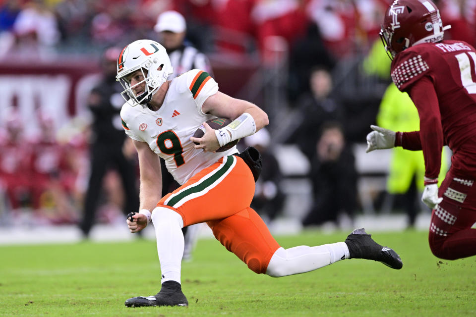 Miami quarterback Tyler Van Dyke runs the ball during the second half of an NCAA college football game against Temple, Saturday, Sept. 23, 2023, in Philadelphia. (AP Photo/Derik Hamilton)