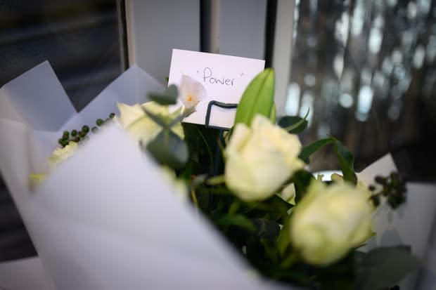 A bouquet of flowers left at the door of Off-White's flagship store in London, following the news of Abloh's passing.<p>Photo: Leon Neal/Getty Images</p>