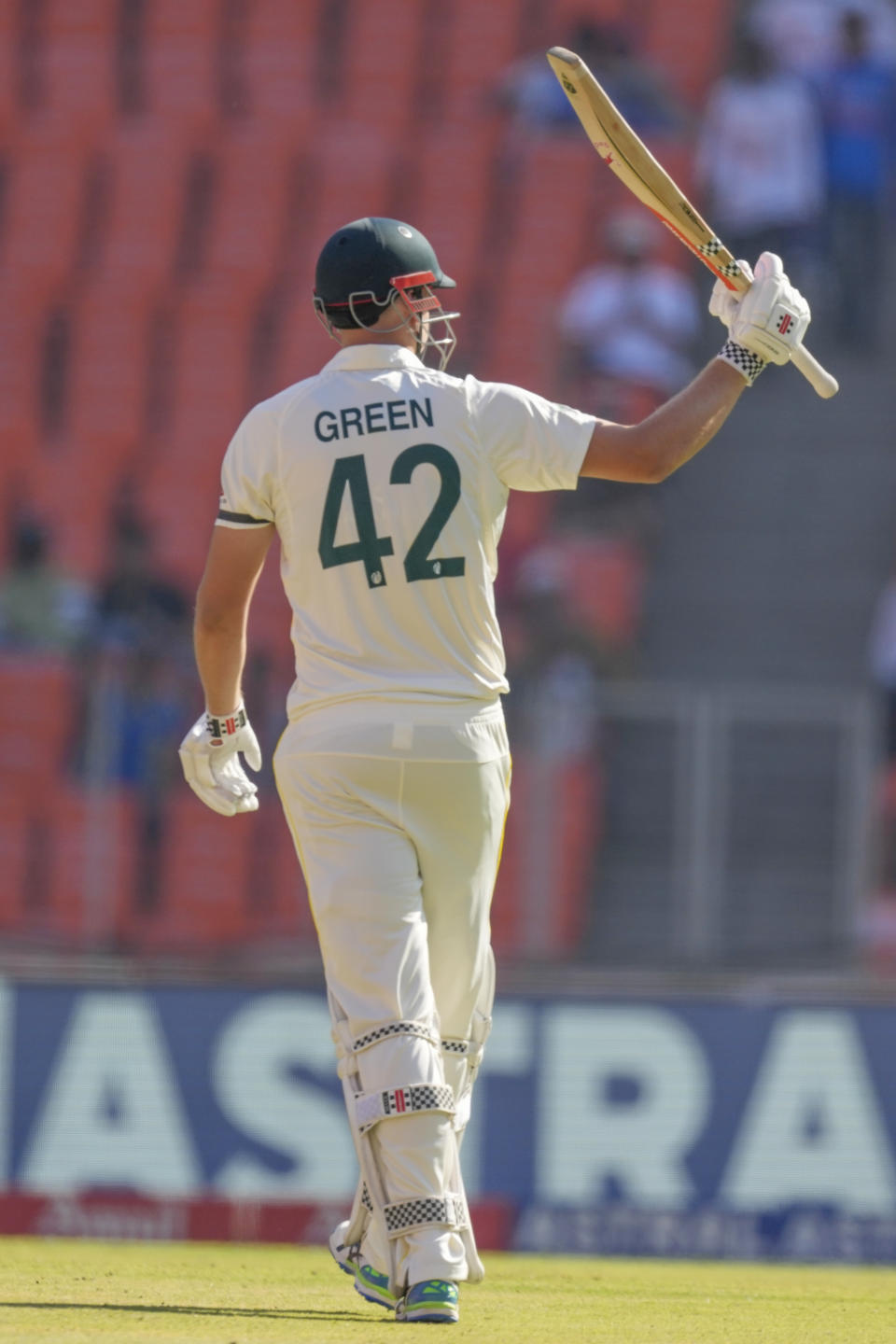 Australia's Cameron Green raises his bat to celebrate scoring a half century during the second day of the fourth cricket test match between India and Australia in Ahmedabad, India, Friday, March 10, 2023. (AP Photo/Ajit Solanki)