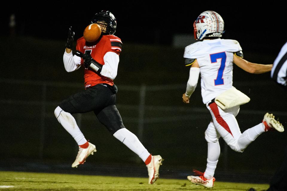 Hillcrest wide receiver Avery McFadden (7) catches the ball as Riverside's Jacob Hartzog (7) approaches during their game Friday, Nov. 5, 2021.