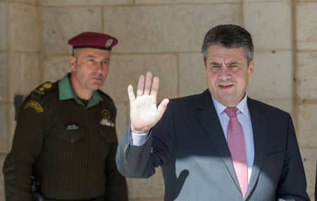 Germany's Foreign Minister Sigmar Gabriel waves upon his arrival for a meeting with Palestinian President Mahmoud Abbas, in the West Bank city of Ramallah January 31, 2018. REUTERS/Atef Safadi/Pool