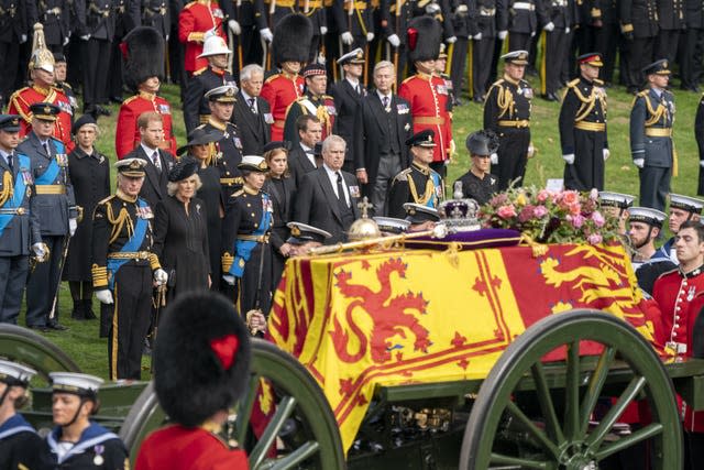 The royal family looks on as the State Gun Carriage carrying the Queen's coffin arrives at Wellington Arch