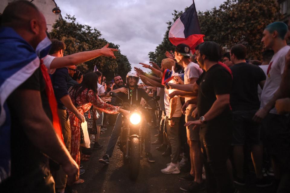 <p>People celebrate France’s victory in central Paris on July 10, 2018 after the final whistle of the Russia 2018 World Cup semi-final football match between France and Belgium. (Photo by Lucas BARIOULET / AFP) </p>