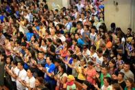 Filipino Catholic devotees gesture as they sing a religious song during a mass at a National Shrine of Our Mother of Perpetual Help in Baclaran, Paranaque city, metro Manila, Philippines September 18, 2016. REUTERS/Romeo Ranoco/File Photo