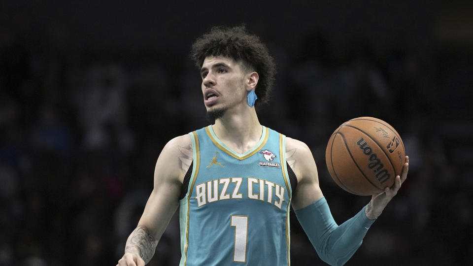 Charlotte Hornets guard LaMelo Ball brings the ball down court against the Milwaukee Bucks during the second half of an NBA basketball game on Friday, Nov. 17, 2023, in Charlotte, N.C. (AP Photo/Chris Carlson)