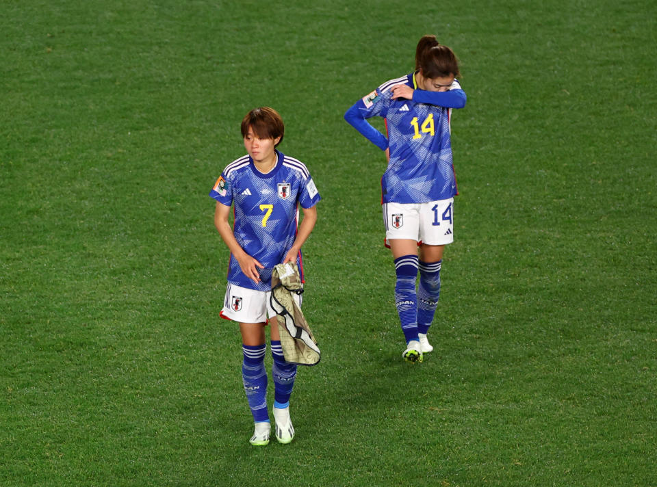 Hinata Miyazawa and Yui Hasegawa leave the field after the unfortunate elimination of Japan, a team that conceded only three goals in five matches.  (Reuters/Hannah McKay)