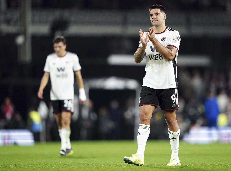 Fulham's Aleksandar Mitrovic applauds the fans after the English Premier League soccer match between Fulham and Everton at Craven Cottage in London, Saturday, Oct. 29, 2022. (Zac Goodwin/PA via AP)