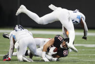 Tennessee Titans inside linebacker Rashaan Evans (54) leaps over Atlanta Falcons tight end Austin Hooper (81) during the first half of an NFL football game, Sunday, Sept. 29, 2019, in Atlanta. (AP Photo/John Bazemore)