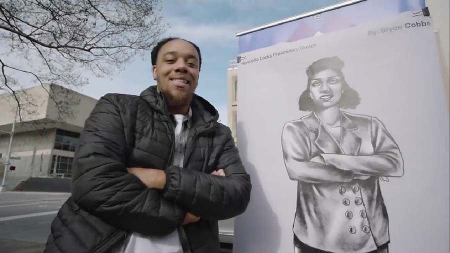 Artist Bryce Cobbs with a preliminary drawing of Henrietta Lacks statue. | Photo Credit: City of Roanoke, Virginia Facebook