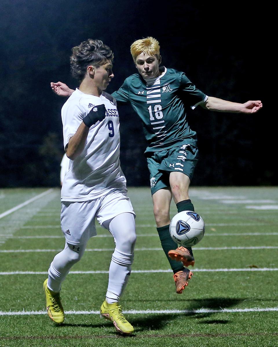 Abington's Cole Lindo looks to clear the ball away from Cohasset's Nathan Askjaer during first OT action of their Round of 16 game against Cohasset in the Division 4 state tournament at Abington High on Wednesday, Nov. 9, 2022. Cohasset would win 3-2 in OT. 