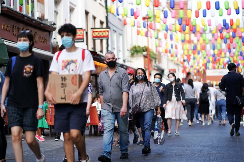 People walk through the Chinatown area, amid the coronavirus disease (COVID-19) outbreak, in London