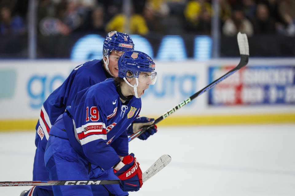 USA's Cutter Gauthier celebrates scoring with Rutger McGroarty during the IIHF World Junior Championship ice hockey semifinal match between USA and Finland at Scandinavium in Gothenburg, Sweden, Thursday, Jan. 4, 2024. (Adam Ihse/TT via AP)