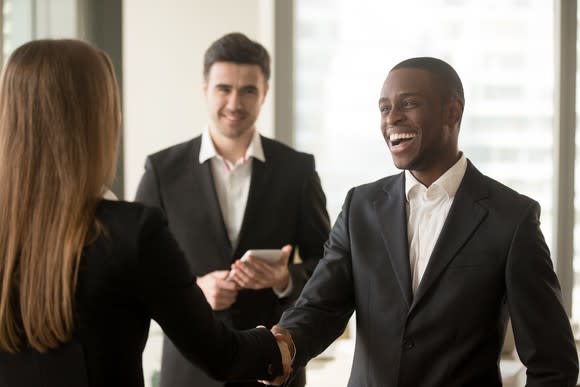 Business people sealing a deal with a handshake