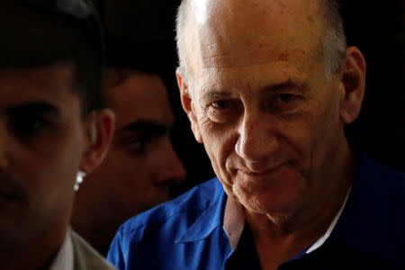 FILE PHOTO: Former Israeli Prime Minister Ehud Olmert leaves Tel Aviv District Court May 13, 2014. REUTERS/Finbarr O'Reilly/File Photo