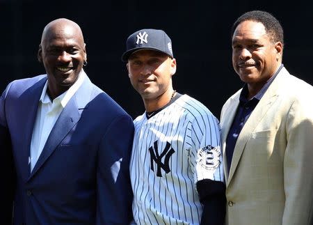 Sep 7, 2014; Bronx, NY, USA; New York Yankees shortstop Derek Jeter (middle) poses with NBA former player Michael Jordan (left) and Yankees former player Dave Winfield at a ceremony before the game against the Kansas City Royals at Yankee Stadium. Mandatory Credit: Noah K. Murray-USA TODAY Sports