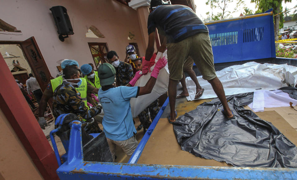 Dead bodies of blast victims are removed from St. Sebastian's Church in Negombo, north of Colombo, Sri Lanka, Sunday, April 21, 2019. More than hundred were killed and hundreds more hospitalized with injuries from eight blasts that rocked churches and hotels in and just outside of Sri Lanka's capital on Easter Sunday, officials said, the worst violence to hit the South Asian country since its civil war ended a decade ago. (AP Photo/Chamila Karunarathne)