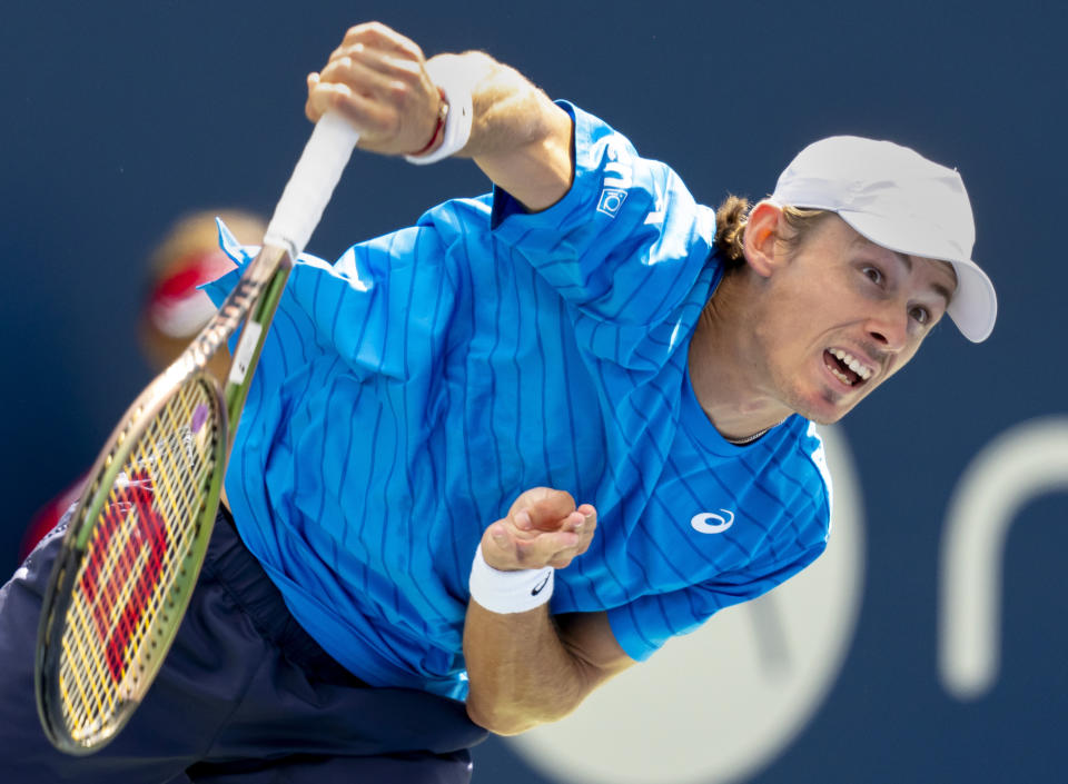 Alex de Minaur, of Australia, serves to Daniil Medvedev,of Russia, in men's quarterfinal tennis match action at the National Bank Open in Toronto, Friday, Aug. 11, 2023. (Frank Gunn/The Canadian Press via AP)