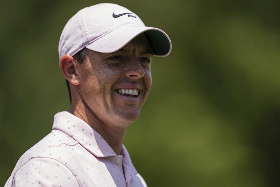 Rory McIlroy smiles after his putt on the third hole during the fourth round of the Wells Fargo Championship golf tournament at Quail Hollow on Sunday, May 9, 2021, in Charlotte, N.C. (AP Photo/Jacob Kupferman)