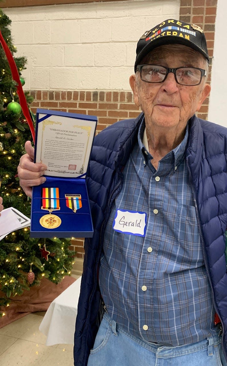 Korean War veteran Gerald E. Carden of Lake City displays his Ambassador for Peace Proclamation and Medal at last December’s Veterans Appreciation Breakfast. The medal is an expression of appreciation from the Korean government to the U.S. service men and women who served in the Korean War.