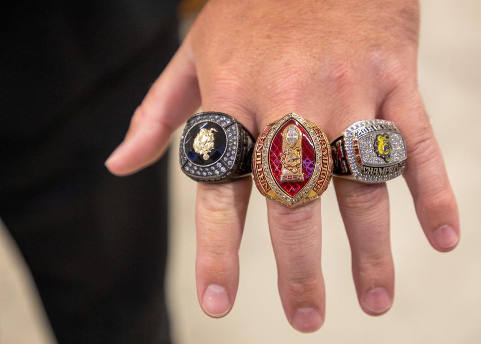 Adam Sieler, Ferris State Universities offensive lineman shows his championship rings before the starts of GLIAC Football Media Day in Detroit on Monday, July 25, 2022. 