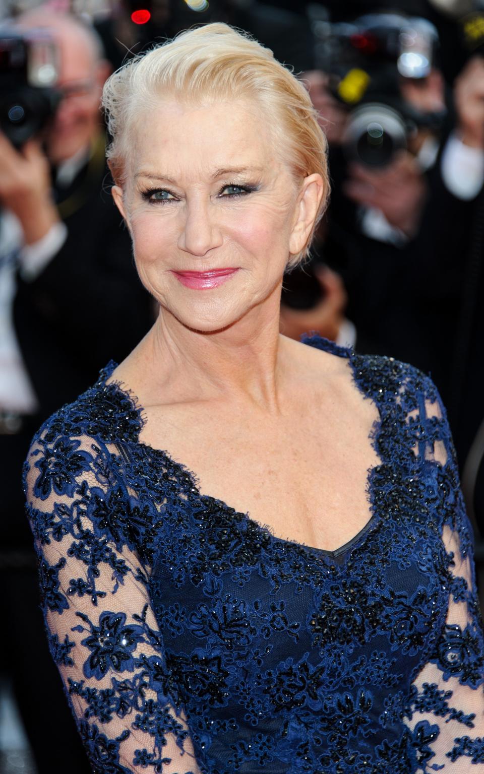 Mirren gave her lace dress modern edge with slicked back hair in Cannes last year - Credit: Rex