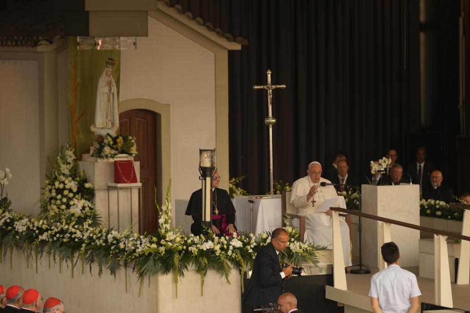 Pope Francis addresses worshipers in front of the statue of Our Lady of Fatima at the holy shrine in Fatima, central Portugal, Saturday, Aug. 5, 2023. Pope Francis is in Portugal through the weekend into Sunday's 37th World Youth Day to preside over the jamboree that St. John Paul II launched in the 1980s to encourage young Catholics in their faith. (AP Photo/Francisco Seco)