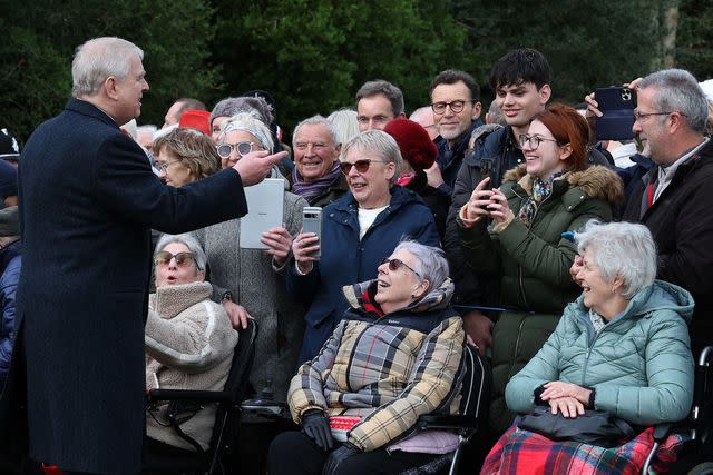 <p>ADRIAN DENNIS/AFP via Getty</p> Prince Andrew chats with well-wishers after attending the royal family's traditional Christmas Day service at St Mary Magdalene Church on Dec. 25, 2023.