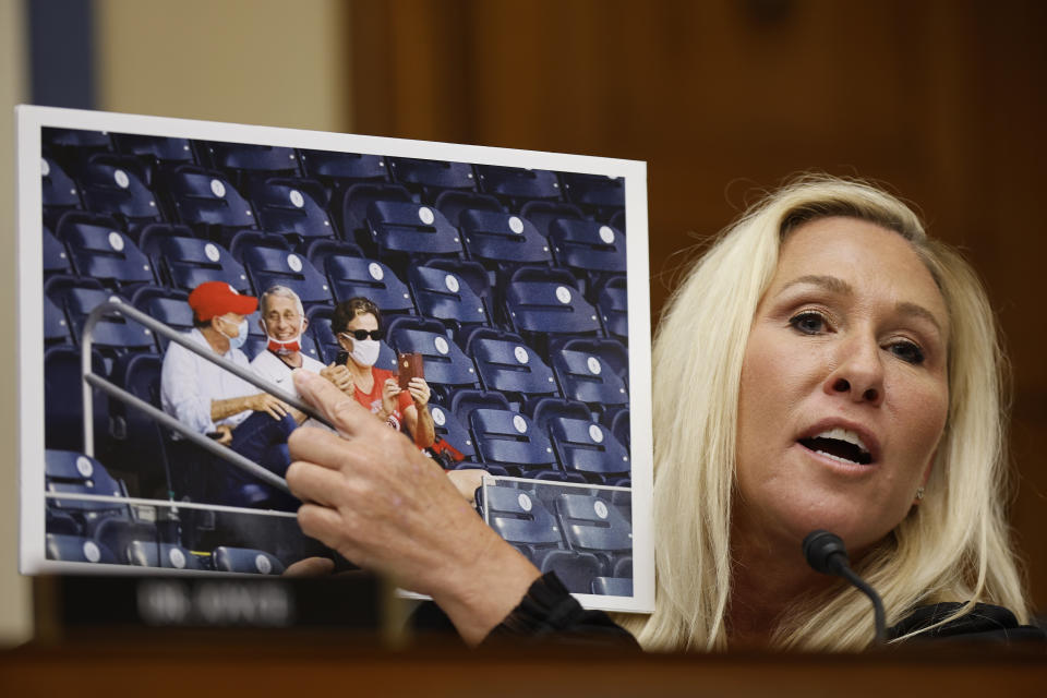 Marjorie Taylor Greene points to a photograph of Fauci while questioning him during a hearing on the COVID-19 pandemic's origins on June 3. (Chip Somodevilla/Getty Images)