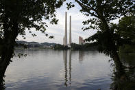 FILE - In this Aug. 7, 2019, photo, the Kingston Fossil Plant stands near a waterway in Kingston, Tenn. The nation’s largest public utility is moving ahead with a plan for a new natural gas plant in Tennessee despite warnings that its environmental review of the project doesn’t comply with federal law. The Environmental Protection Agency asked the Tennessee Valley Authority in a March 25, 2024 letter to redo several aspects of its environmental impact statement for converting the coal-burning Kingston Fossil Plant. (AP Photo/Mark Humphrey, File)