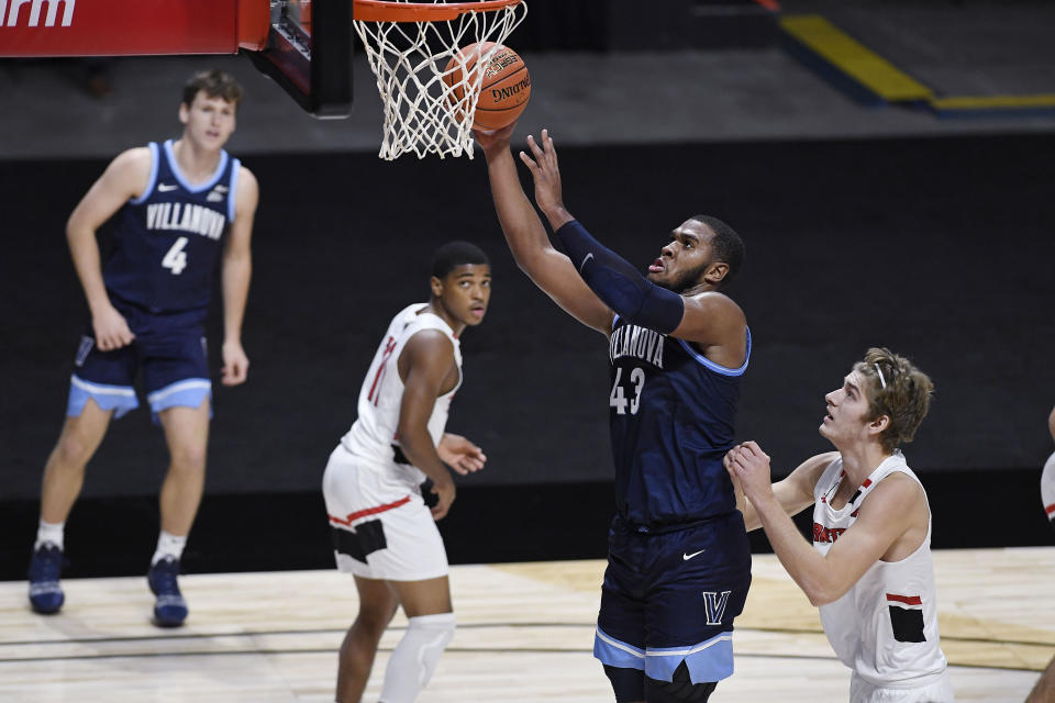 Villanova's Eric Dixon shoots as Hartford's Michael Dunne, right, defends during the second half of an NCAA college basketball game Tuesday, Dec. 1, 2020, in Uncasville, Conn. (AP Photo/Jessica Hill)