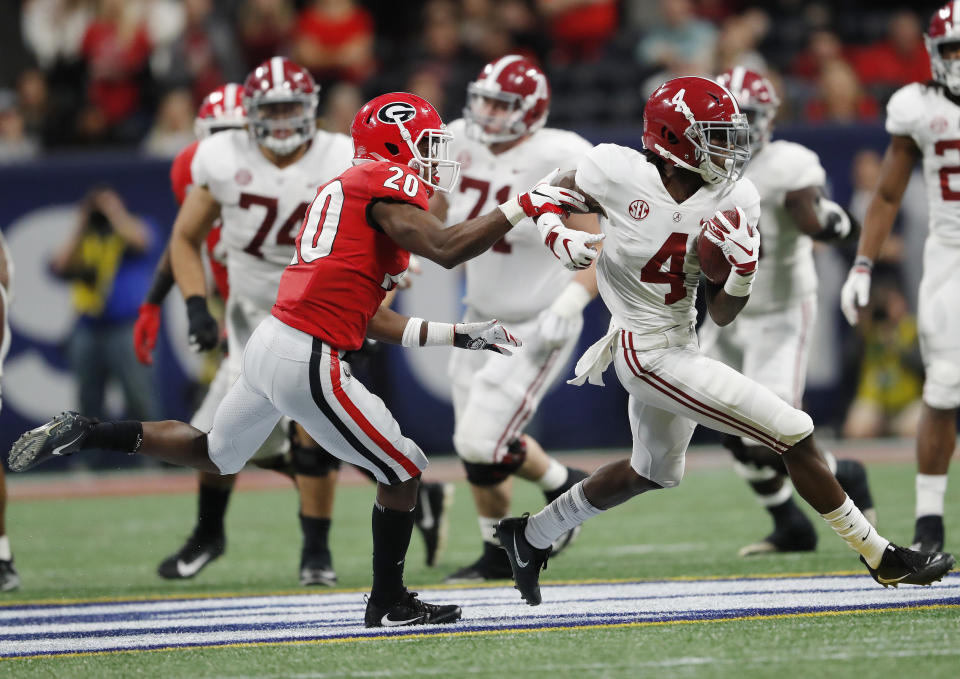 Georgia defensive back J.R. Reed (20) chases Alabama wide receiver Jerry Jeudy (4) during the second half of the Southeastern Conference championship NCAA college football game, Saturday, Dec. 1, 2018, in Atlanta. (AP Photo/John Bazemore)