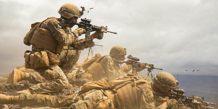 Marines fire at targets during a mock platoon-supported attack as part of Exercise Bougainville II at Pōhakuloa Training Area, Hawaii, May 9, 2019.