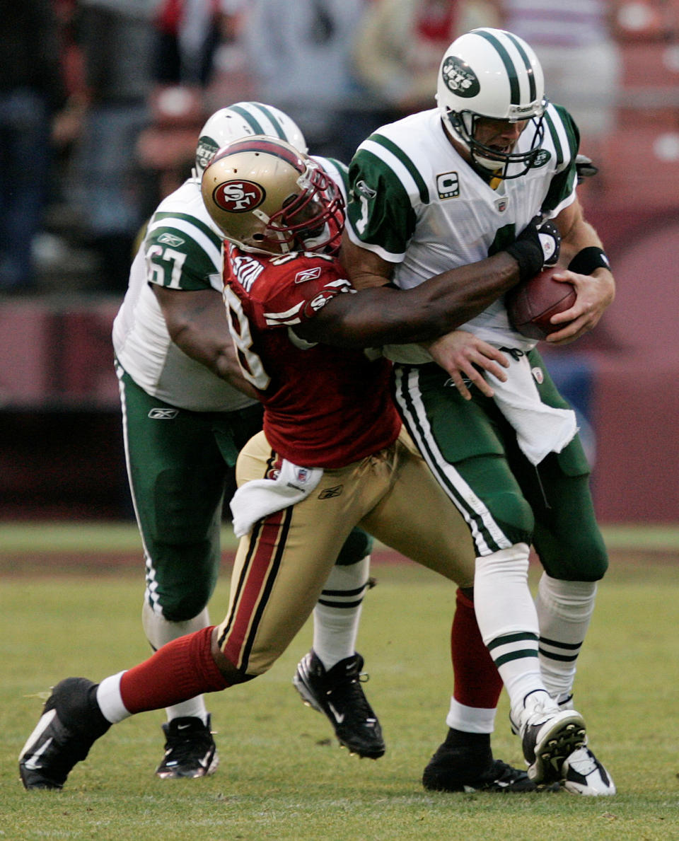 FILE - In this Sunday, Dec. 7, 2008, file photo, New York Jets quarterback Brett Favre is sacked by San Francisco 49ers linebacker Parys Haralson during the fourth quarter of an NFL football game in San Francisco. On Monday, Sept. 13, 2021, the San Francisco 49ers announced that Haralson, a former linebacker for the 49ers and New Orleans Saints, had died. He was 37. (AP Photo/Marcio Jose Sanchez, File)