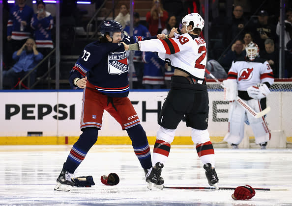 NEW YORK, NEW YORK – APRIL 03: Kurtis MacDermid #23 of the New Jersey Devils fights with Matt Rempe #73 of the New York Rangers during the first period at Madison Square Garden on April 03, 2024 in New York City. (Photo by Bruce Bennett/Getty Images)