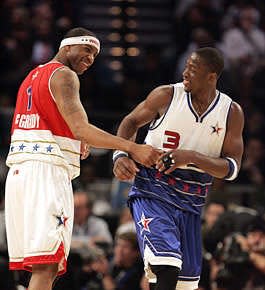 Houston's Tracy McGrady (1) shares a laugh with Miami's Dwyane Wade during an NBA All-Star Game in Houston.