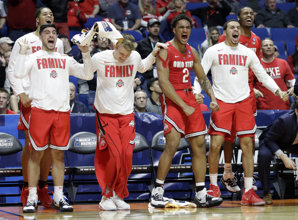 Members of Ohio State cheer from the bench during the second half of a first round men's college basketball game against Iowa State in the NCAA Tournament Friday, March 22, 2019, in Tulsa, Okla. Ohio State won 62-59. (AP Photo/Jeff Roberson)