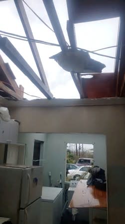 A damaged roof is seen at the house of a survivor following the aftermath of Hurricane Dorian in Marsh Harbour