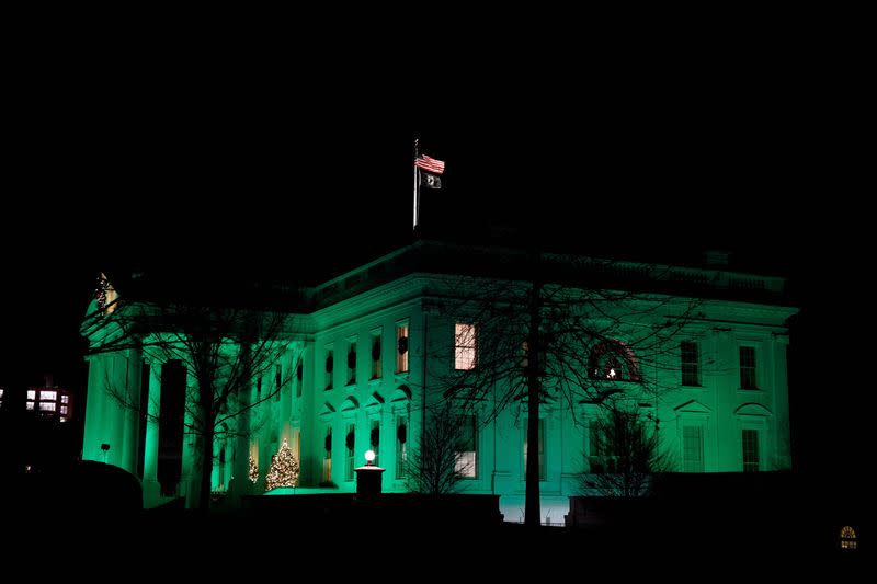 FILE PHOTO: Green lights illuminate the White House on the 10th anniversary of the shooting at Sandy Hook Elementary School, in Washington