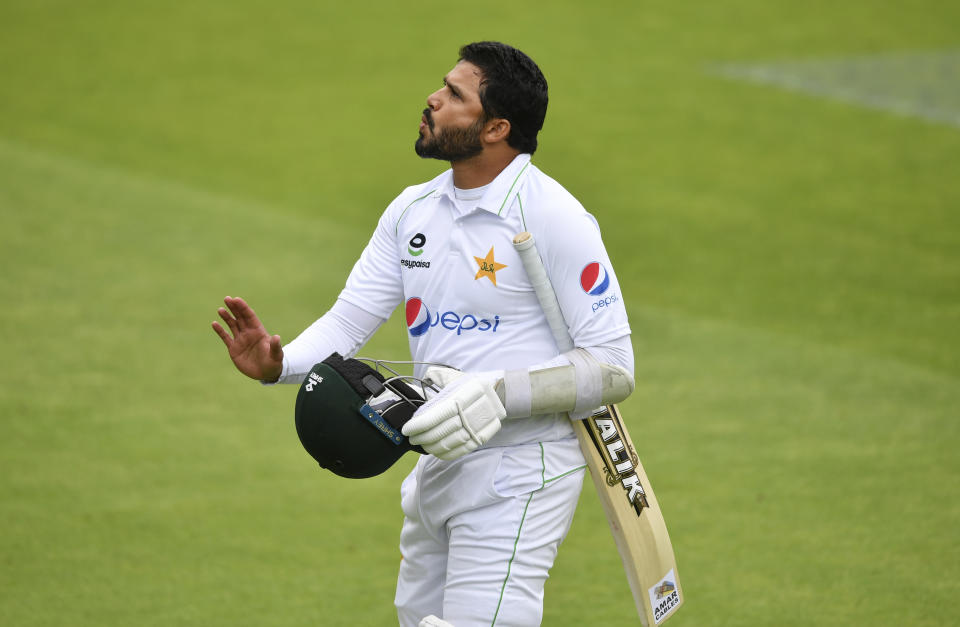 Pakistan's captain Azhar Ali reacts as he leaves the field after being dismissed by England's Chris Woakes during the first day of the first cricket Test match between England and Pakistan at Old Trafford in Manchester, England, Wednesday, Aug. 5, 2020. (Dan Mullan/Pool via AP)