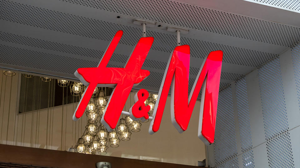  H&M logo hangs on display outside a H&M store on Nanjing Road Pedestrian Street on March 24, 2021 in Shanghai, China. 