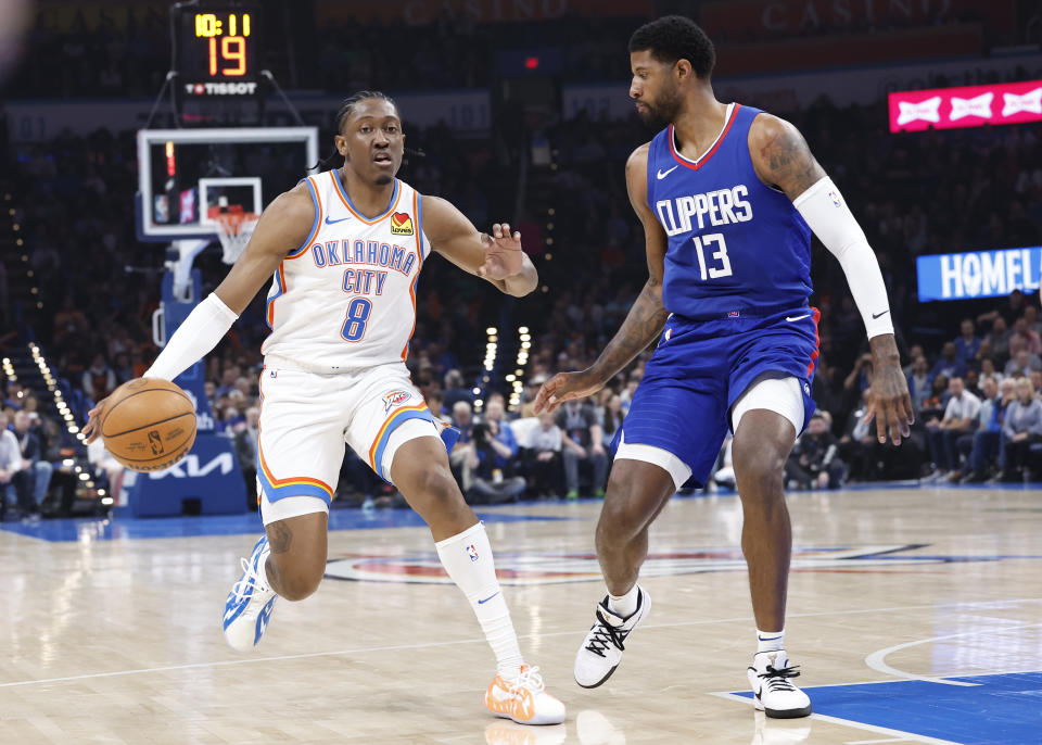 Feb 22, 2024; Oklahoma City, Oklahoma, USA; Oklahoma City Thunder forward Jalen Williams (8) moves the ball down the court beside LA Clippers forward Paul George (13) during the second quarter at Paycom Center. Mandatory Credit: Alonzo Adams-USA TODAY Sports