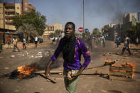 Protestors take to the streets of Burkina Faso's capital Ouagadougou Saturday Nov. 27, 2021, calling for President Roch Marc Christian Kabore to resign. The protest comes after the deadliest attack in years against the security forces in the Sahel's Soum province earlier this month, where more than 50 security forces were killed and after an attack in the Center North region where 19 people including nine members of the security forces were killed. (AP Photo/Sophie Garcia)