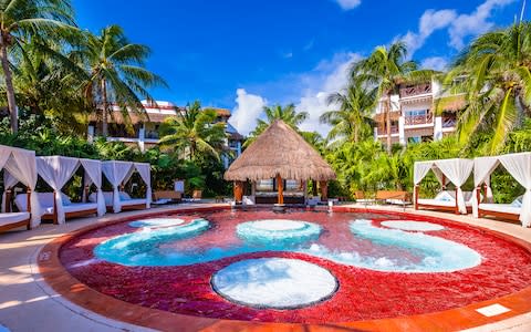 The pool area at Desire Riviera Maya, with beds and all - Credit: Desire Resorts & Spa