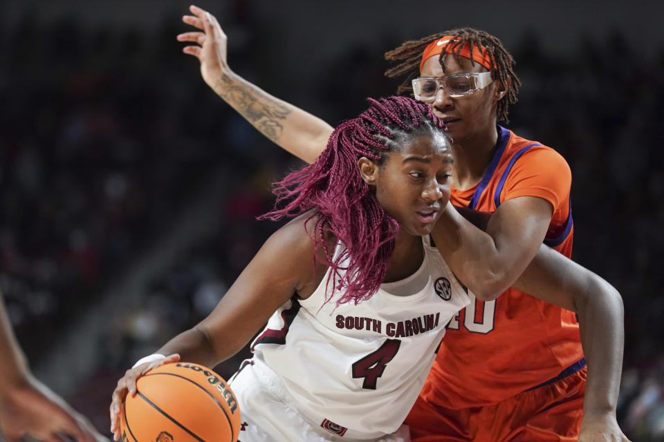 South Carolina forward Aliyah Boston (4) drives against Clemson center LaTrese Saine (40) during the first half of an NCAA college basketball game Wednesday, Nov. 17, 2021, in Columbia, S.C. (AP Photo/Sean Rayford)