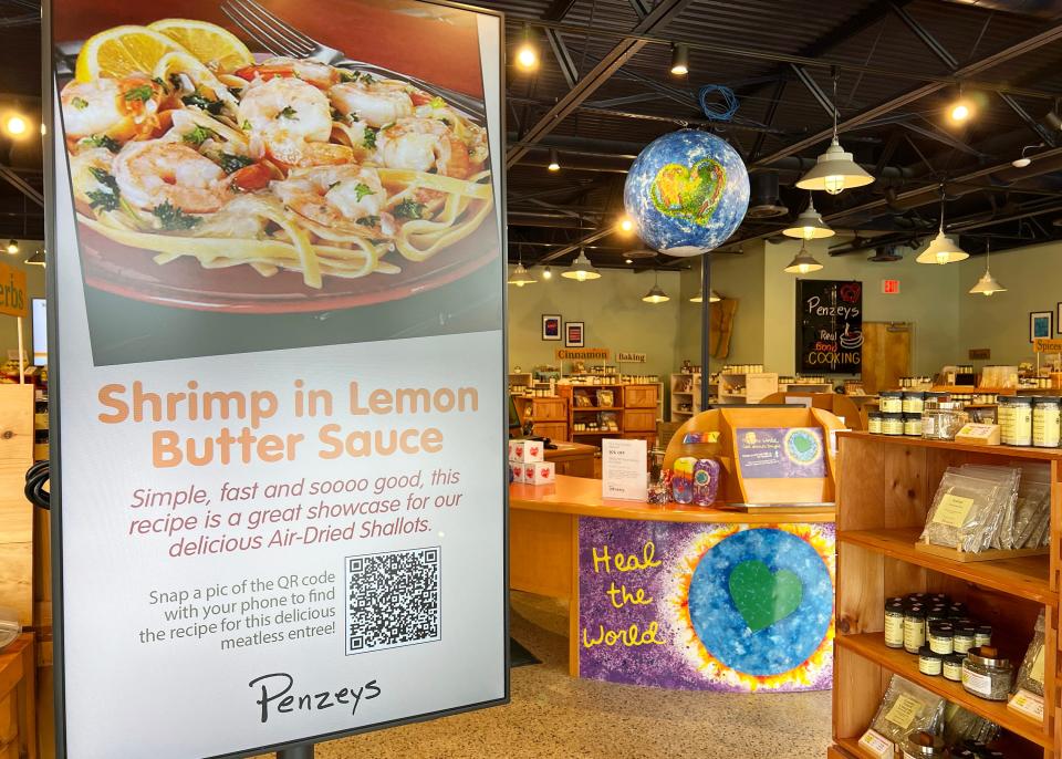 A screen at Penzey's Spices in Orlando displays different recipes.